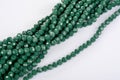 Green Glass Sparkle Crystal Isoalted Beads on white background. Use for diy beaded jewelry Royalty Free Stock Photo