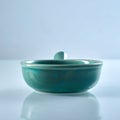 Green glazed ceramic ramekin with handle