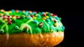 Green glazed donut with sprinkles isolated. Close up of colorful donut Royalty Free Stock Photo