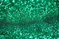Green glitter made by bokeh effect abstract background, copy space.