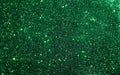 Green glitter texture background. Stars Sparkle Background, Vibrant bright glitter background.