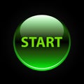 Green glossy start button on black