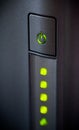 Green glowing power button. Closeup Royalty Free Stock Photo