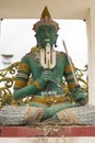 Green God Indra statue in Thai temple