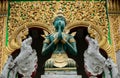 Green and gold Buddha statue in Thailand Royalty Free Stock Photo