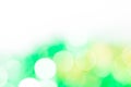 Green and golden bokeh lights. Abstract background. Half white. Royalty Free Stock Photo