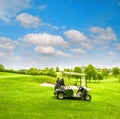 Green golf course field with fresh grass blue sky Royalty Free Stock Photo