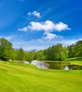 Green golf field with blue sky Royalty Free Stock Photo