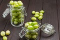 Green gooseberries in two glass jars Royalty Free Stock Photo