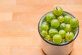 Green gooseberry fruit closeup isolated on wooden background. Fresh ripe gooseberry.diet, vegetarianism, vegan food Royalty Free Stock Photo