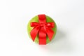 Green grapefruit with red ribbon