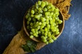 Green grapes on concrete backgroundn natural healthy