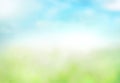 Green grass blue sky blurred bokeh background.Abstract spring summer nature backdrop,de focused illustration Royalty Free Stock Photo