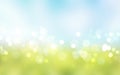 Green grass blue sky blurred bokeh background.Nature landscape defocused backdrop