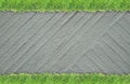 Green grass border on cement wall background Royalty Free Stock Photo
