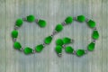 Green grass bulbs, infinity symbol, ECO circular economy Royalty Free Stock Photo