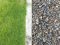 Green grass and colorful pebble background.