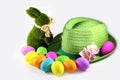 Green Grass Easter Bunny Rabbit With A Green Straw Hat With Easter Colorful Eggs