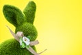 Green Grass Easter Bunny Shape on Yellow Spring Background. Easter Design
