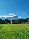 Green grass field with abandoned building on May 30th 2020 at Kota Belud, Sabah, Malaysia.