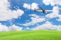 Green grass field with airplane ,blue sky and cloud background.