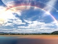 Green Grass Field Blue white clouds sky and rainbow nature summer landscape background Royalty Free Stock Photo