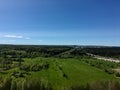 Green grass field and bright blue sky. Background Royalty Free Stock Photo