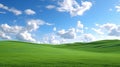 Green grass field on small hills and blue sky with clouds Royalty Free Stock Photo