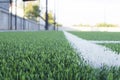 Green grass field for soccer or football competition.Decorate sports game stadium background.Popular foot sport.Fans stadium side Royalty Free Stock Photo