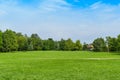 Green grass green trees in beautiful park white Cloud blue sky in noon. - Image Royalty Free Stock Photo