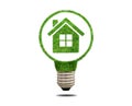 Green grass light bulb with house inside Royalty Free Stock Photo