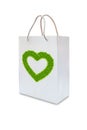 Green grass love heart on white paper bag Royalty Free Stock Photo