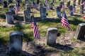 Rows of Civil War soldiers gravestones tombstones with flags in cemetery Royalty Free Stock Photo