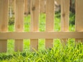 Green grass over wood fence background Royalty Free Stock Photo