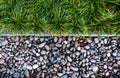 Green grass and pebbles stone divided in two, flat lay Royalty Free Stock Photo