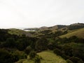 Green grass rolling hills of Coromandel Peninsula Manaia Saddle Lookout State Highway 25 SH25 Kereta Waikato New Zealand Royalty Free Stock Photo