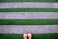 Green grass stair step with woman foot on white shoes, background and textures