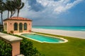 Green grass terrace near swimming pool and garden in modern beach house or luxury villa.