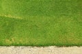 Green grass texture background of golf course with concrete area. Royalty Free Stock Photo