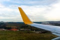 Green grassland seen through window of an taxiing aircraft