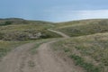 Green, grassy hill. The path, the road on the hill. Summer season. Nature. Royalty Free Stock Photo