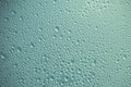 Green and gray metal texture with small circles. Turquoise metallic background with bubbles. Shiny convex surface. Abstract patter Royalty Free Stock Photo