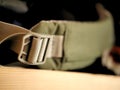 Green and grey back pack strap for camping, hiking, and backpacking.