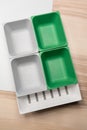 Green and grey plastic trays arrangement. Royalty Free Stock Photo