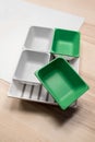 Green and grey plastic trays arrangement. Royalty Free Stock Photo