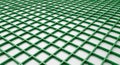 Green grid pattern made of plastic creates a perspective of intersecting lines forming Royalty Free Stock Photo