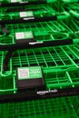 Green grocery carts at the Amazon Fresh location in Factoria