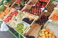 Showing the fresh fruit for sale outside the store.