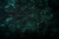 Green grunge background with space for text. Deep emerald green texture or background with stains, waves, and grain elements. Royalty Free Stock Photo