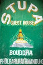 A green guest-house sign